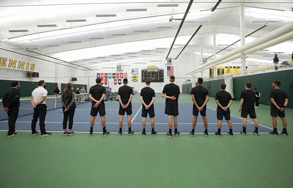 The Hawkeyes stand for the National Anthem before their match at the Hawkeye Tennis and Recreation Complex in Iowa City on Thursday, January 16, 2020. (Stephen Mally/hawkeyesports.com)