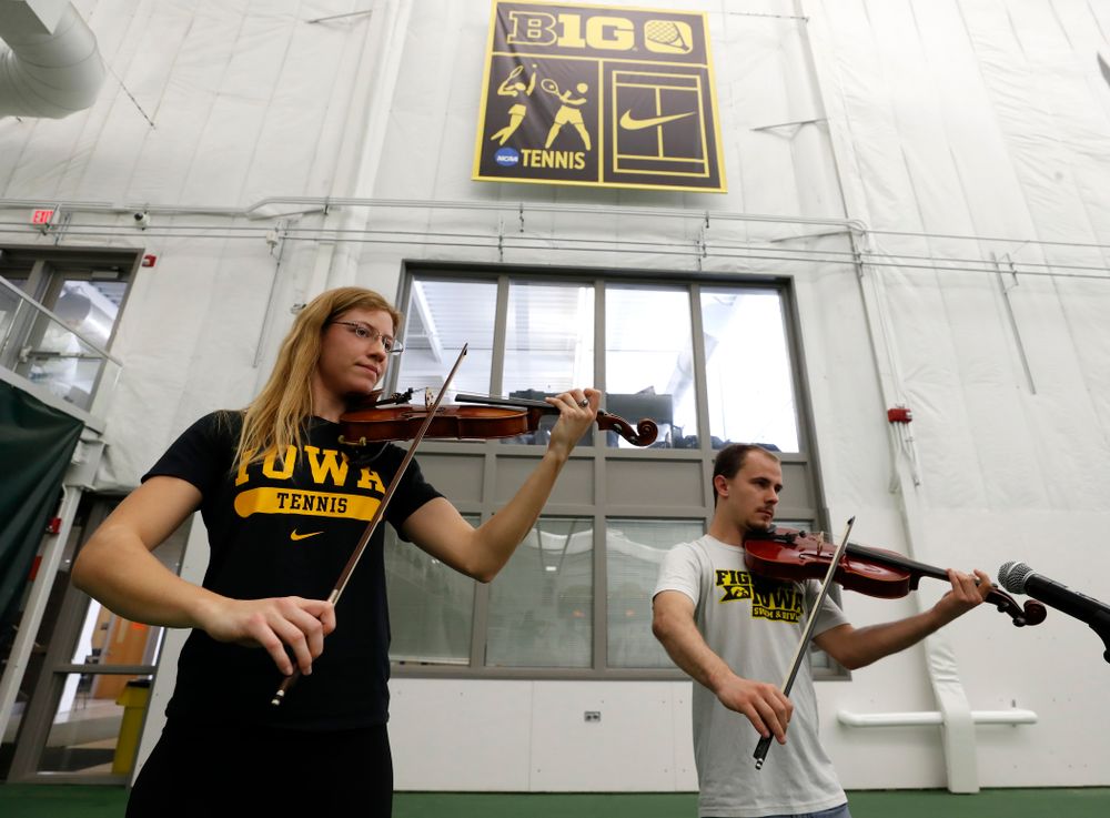 Iowa Diver Anton Hoherz and Women's Tennis Player Montana Crawford play the National Anthem before the Iowa Hawkeyes game against Purdue Sunday, April 15, 2018 at the Hawkeye Tennis and Recreation Center. (Brian Ray/hawkeyesports.com)