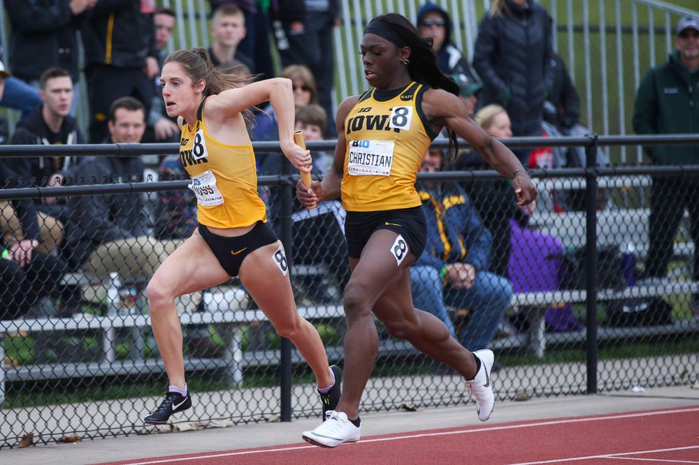 Iowa's Talia Buss and Antonise Christian during women's 4x100 meter relay at Big Ten Outdoor Track and Field Championships at Francis X. Cretzmeyer Track on Sunday, May 12, 2019. (Lily Smith/hawkeyesports.com)