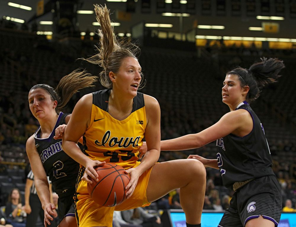Iowa forward Amanda Ollinger (43) pulls down a rebound during the third quarter of their game against Winona State at Carver-Hawkeye Arena in Iowa City on Sunday, Nov 3, 2019. (Stephen Mally/hawkeyesports.com)