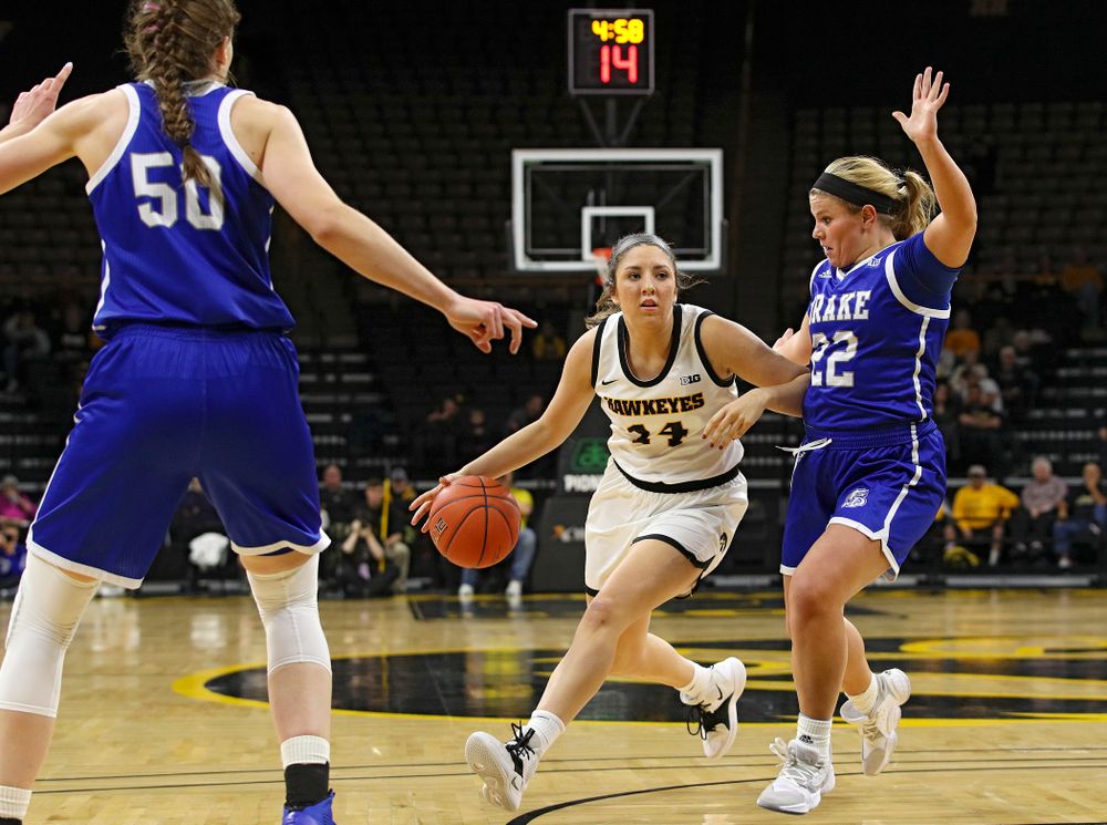 Iowa Hawkeyes guard Mckenna Warnock (14) drives with the ball during the first quarter of their game at Carver-Hawkeye Arena in Iowa City on Saturday, December 21, 2019. (Stephen Mally/hawkeyesports.com)