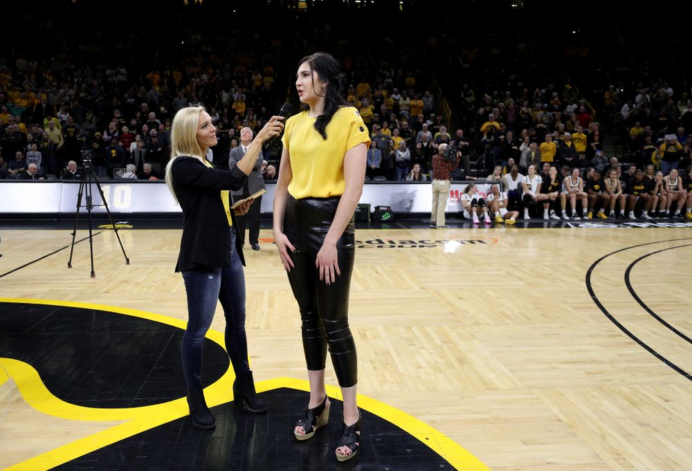 Megan Gustafson is interviewed by Laura Vandeberg during a jersey retirement ceremony Sunday, January 26, 2020 at Carver-Hawkeye Arena. (Brian Ray/hawkeyesports.com)