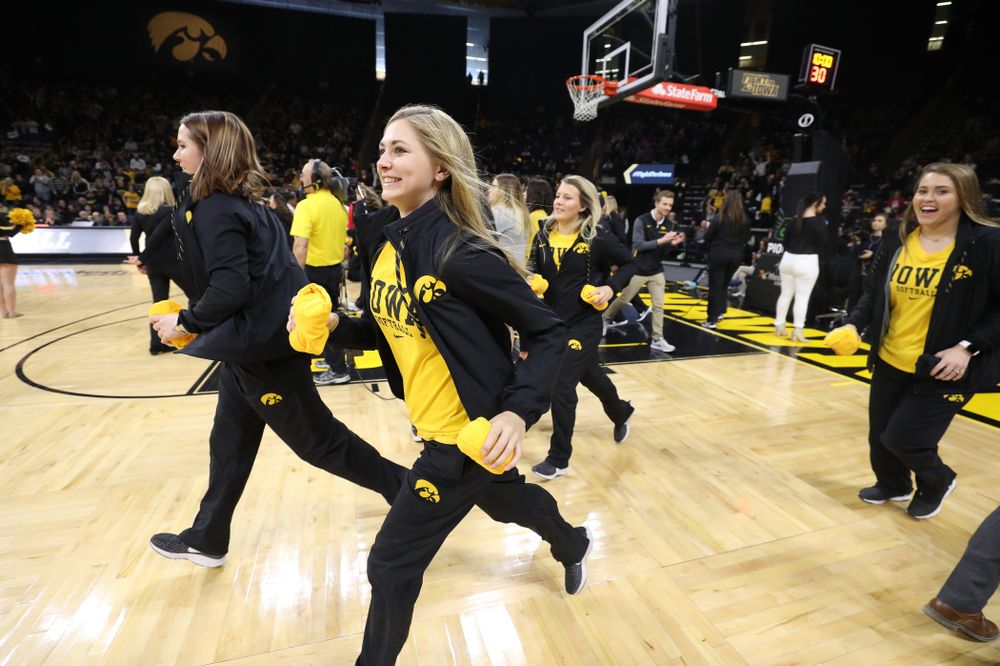 The Iowa Softball team throws out t-shirts during the Iowa Hawkeyes game against the Purdue Boilermakers Sunday, January 27, 2019 at Carver-Hawkeye Arena. (Brian Ray/hawkeyesports.com)