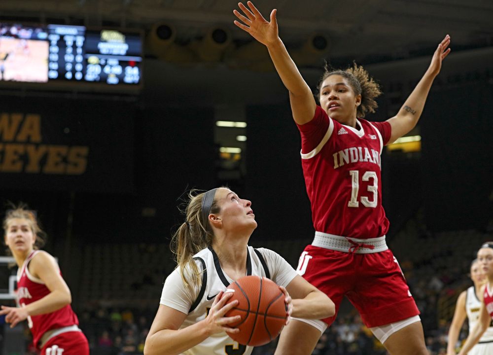 Iowa Hawkeyes guard Makenzie Meyer (3) waits for Indiana Hoosiers guard Jaelynn Penn (13) to clear before making a basket during the second quarter of their game at Carver-Hawkeye Arena in Iowa City on Sunday, January 12, 2020. (Stephen Mally/hawkeyesports.com)