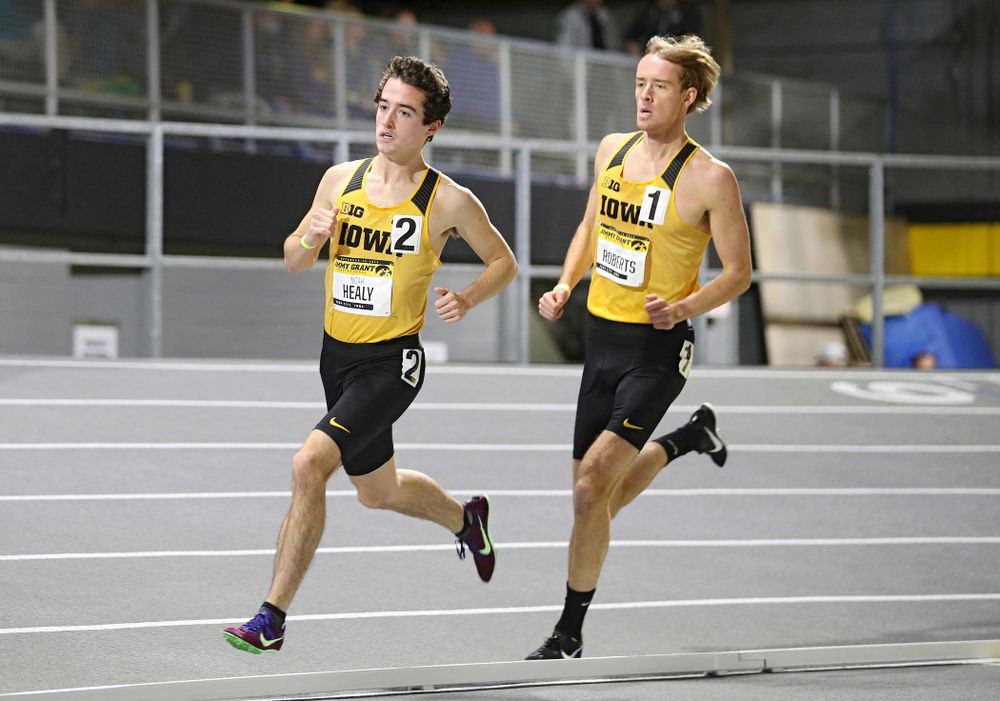 Iowa’s Noah Healy (from left) and Jeff Roberts run the men’s 1 mile run event during the Jimmy Grant Invitational at the Recreation Building in Iowa City on Saturday, December 14, 2019. (Stephen Mally/hawkeyesports.com)