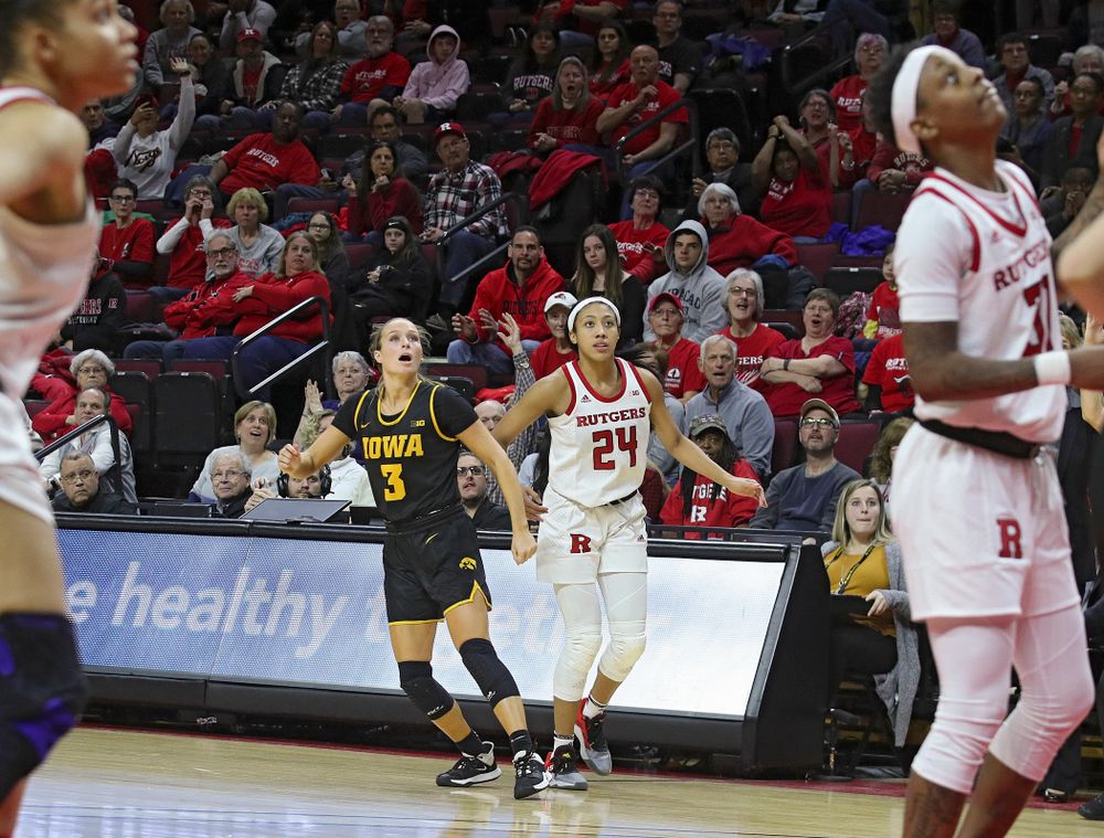 Iowa guard Makenzie Meyer (3) watches her 3-pointer sail into the basket during the fourth quarter of their game at the Rutgers Athletic Center in Piscataway, N.J. on Sunday, March 1, 2020. (Stephen Mally/hawkeyesports.com)