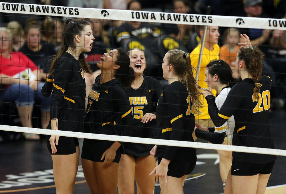 Iowa Hawkeyes setter Courtney Buzzerio (2) celebrates a kill with setter Brie Orr (7) against the Iowa State Cyclones Saturday, September 21, 2019 during the Iowa Corn Cy-Hawk Series Tournament at Carver-Hawkeye Arena. (Brian Ray/hawkeyesports.com)