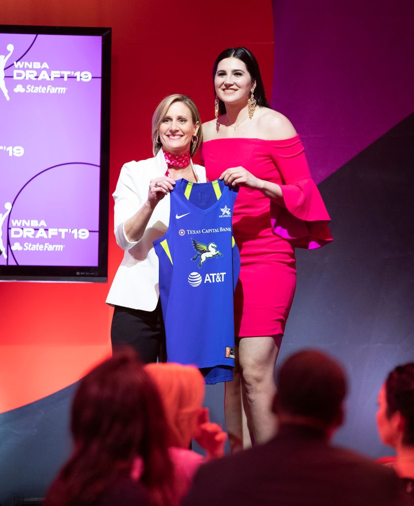 Iowa Hawkeyes forward Megan Gustafson (10) holds up a jersey after being selected by the Dallas Wings in the second round of the 2019 WNBA Draft Wednesday, April 10, 2019 at Nike New York Headquarters in New York City. (Brian Ray/hawkeyesports.com)