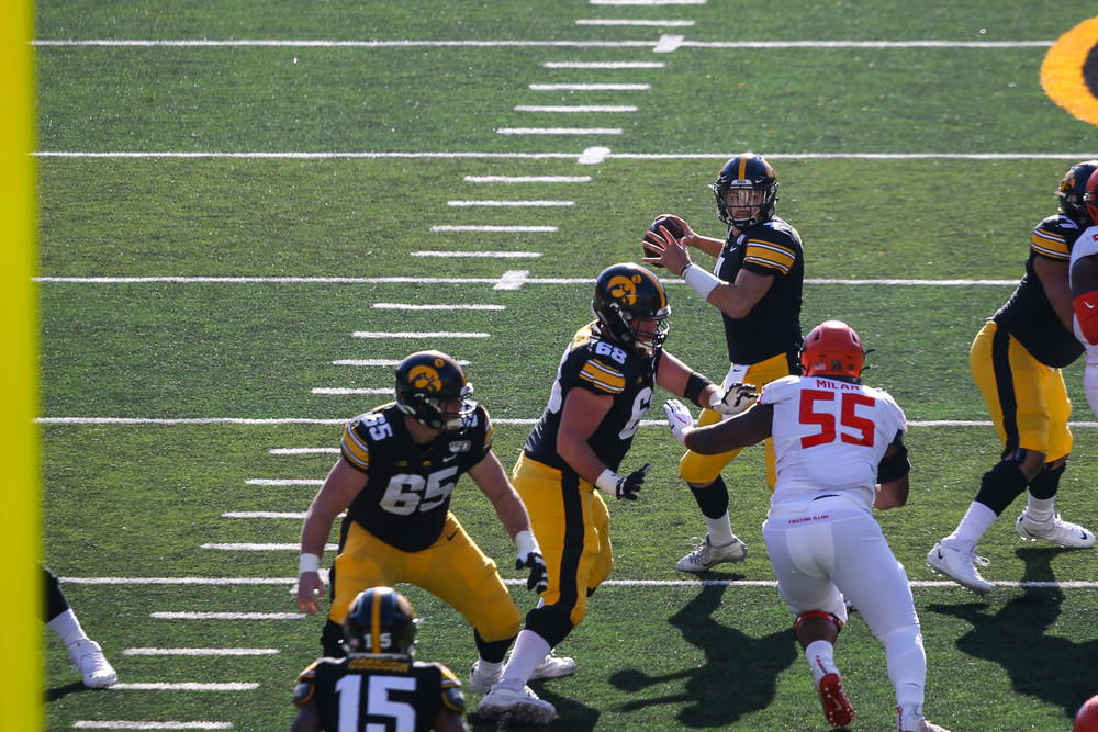 Iowa Hawkeyes quarterback Nate Stanley (4) and Iowa Hawkeyes offensive lineman Landan Paulsen (68) during Iowa football vs Illinois on Saturday, November 23, 2019 at Kinnick Stadium. (Lily Smith/hawkeyesports.com)