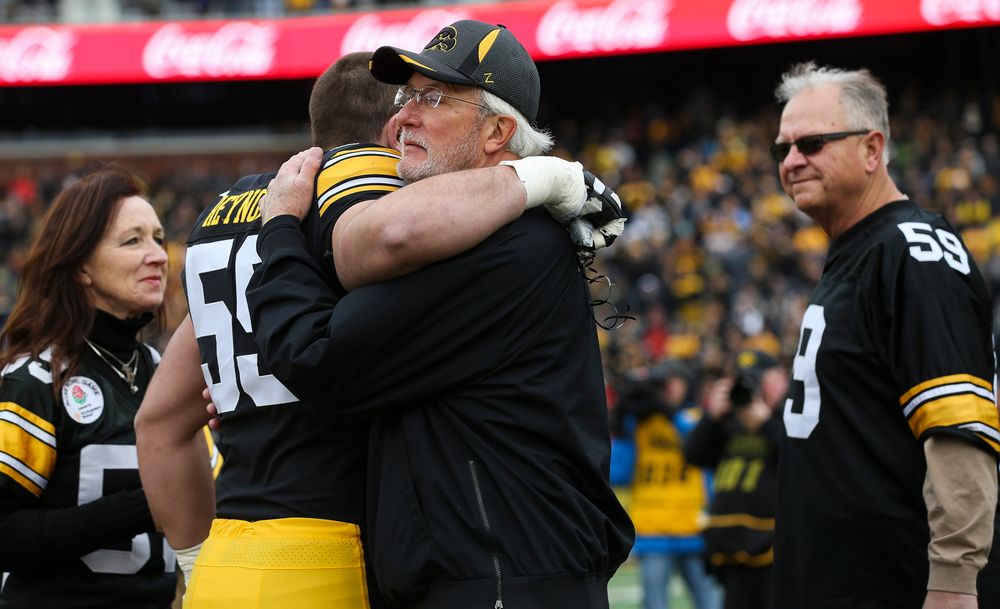 Iowa Hawkeyes offensive lineman Ross Reynolds (59) gets a hug from his father during Senior Day ceremonies before a game against Nebraska at Kinnick Stadium on November 23, 2018. (Tork Mason/hawkeyesports.com)