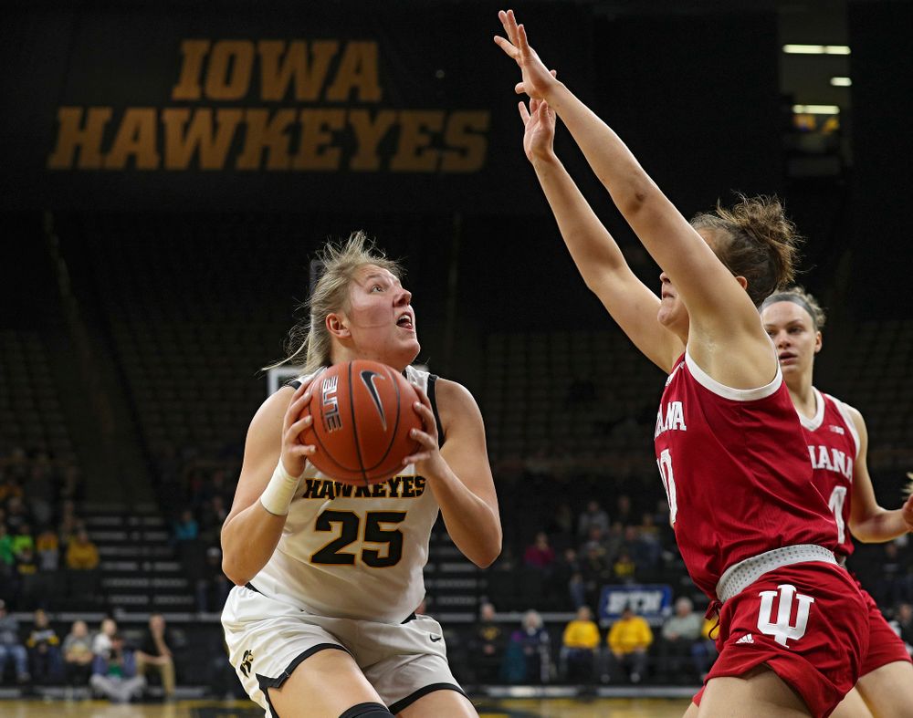 Iowa Hawkeyes forward Monika Czinano (25) eyes the basket during the first quarter of their game at Carver-Hawkeye Arena in Iowa City on Sunday, January 12, 2020. (Stephen Mally/hawkeyesports.com)
