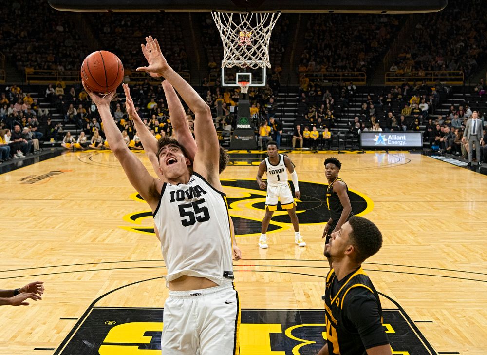 Iowa Hawkeyes center Luka Garza (55) scores a bucket during the second half of their their game at Carver-Hawkeye Arena in Iowa City on Sunday, December 29, 2019. (Stephen Mally/hawkeyesports.com)