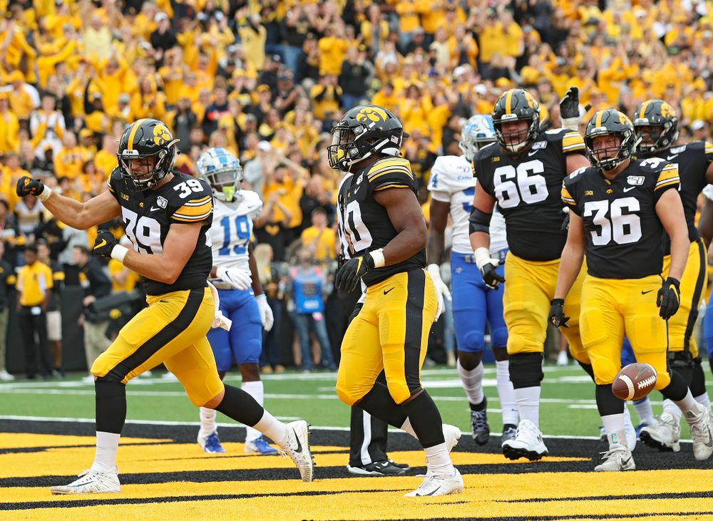 Iowa Hawkeyes tight end Nate Wieting (39) pumps his fist after running back Mekhi Sargent (10) scores a touchdown during the first quarter of their game at Kinnick Stadium in Iowa City on Saturday, Sep 28, 2019. (Stephen Mally/hawkeyesports.com)