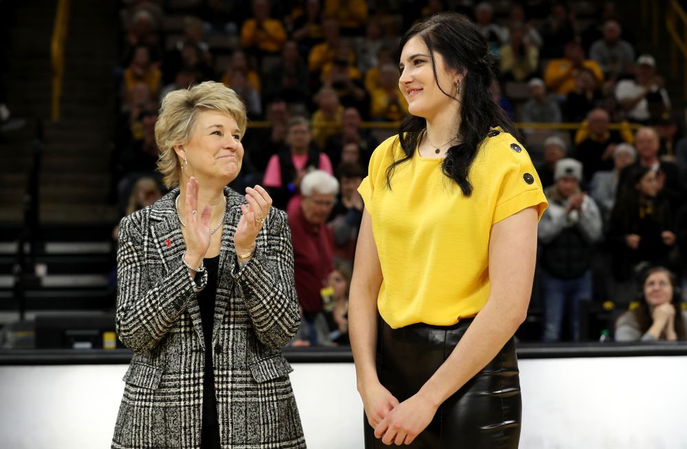 Megan Gustafson stands with Iowa Hawkeyes head coach Lisa Bluder during a jersey retirement ceremony Sunday, January 26, 2020 at Carver-Hawkeye Arena. (Brian Ray/hawkeyesports.com)