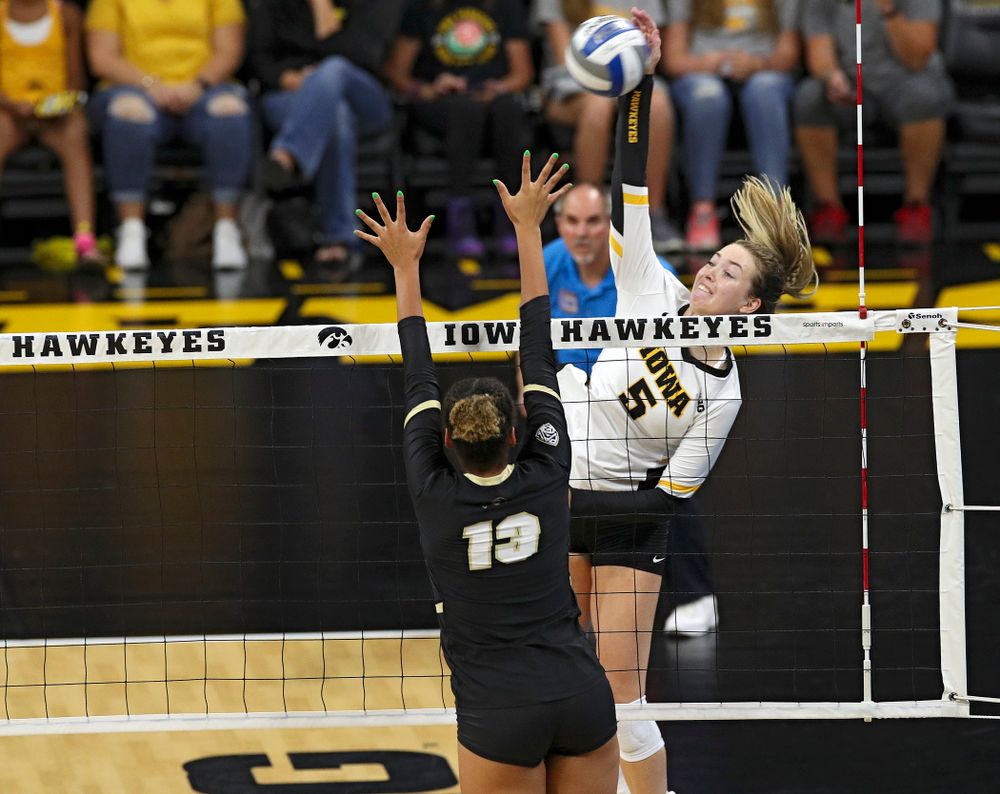 Iowa’s Meghan Buzzerio (5) goes up for a kill during the first set of their Big Ten/Pac-12 Challenge match against Colorado at Carver-Hawkeye Arena in Iowa City on Friday, Sep 6, 2019. (Stephen Mally/hawkeyesports.com)