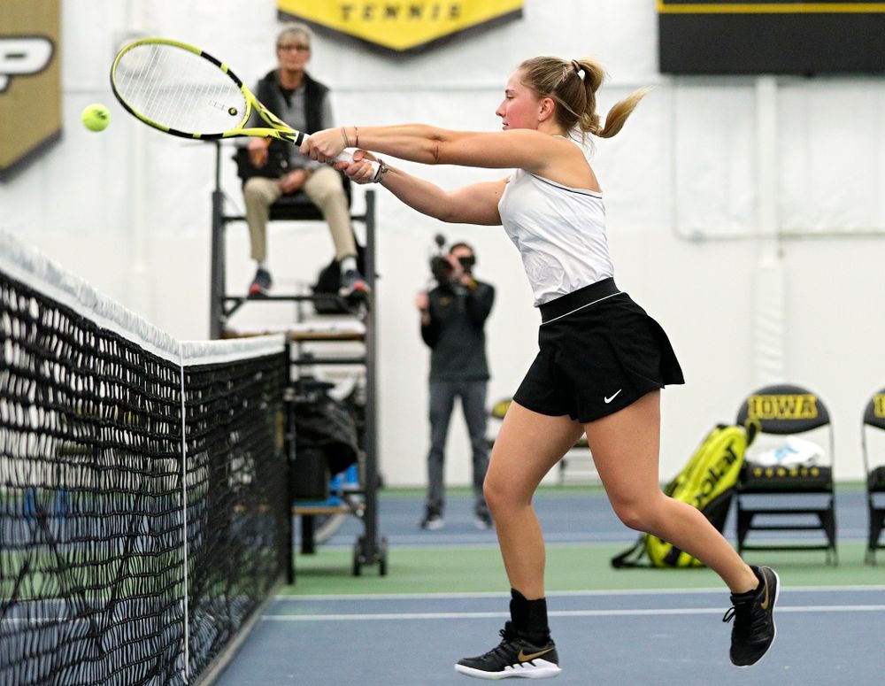 Iowa’s Danielle Burich returns a shot at the net during her doubles match at the Hawkeye Tennis and Recreation Complex in Iowa City on Sunday, February 16, 2020. (Stephen Mally/hawkeyesports.com)