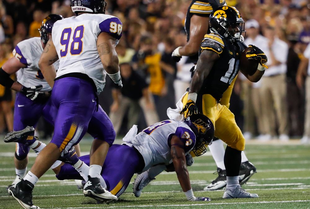 Iowa Hawkeyes running back Mekhi Sargent (10) breaks a tackle during a game against Northern Iowa at Kinnick Stadium on September 15, 2018. (Tork Mason/hawkeyesports.com)