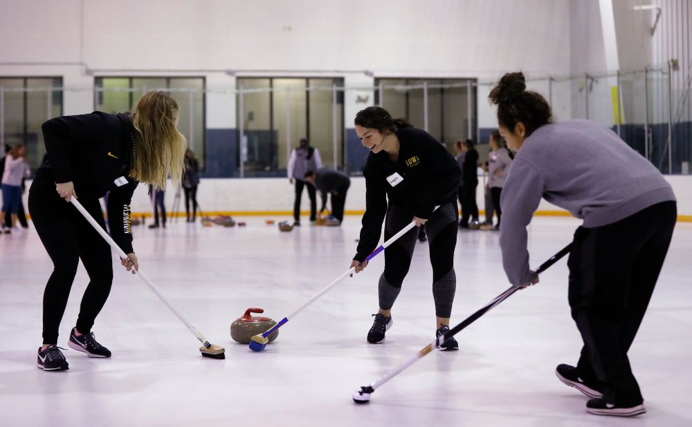 Members of the Iowa Softball team learn the sport of curling as part of a team building event Wednesday, January 10, 2018 at the Cedar Rapids Ice Arena. (Brian Ray/hawkeyesports.com)