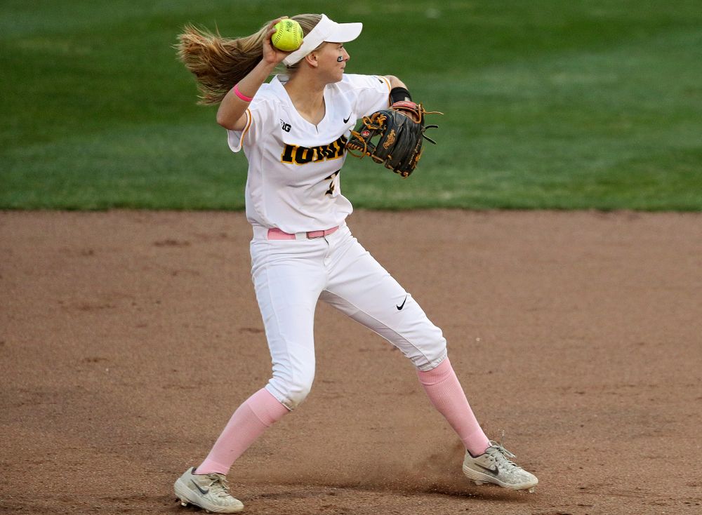 Iowa second baseman Aralee Bogar (2) throws to first as she turns a double play during the fifth inning of their game against Iowa State at Pearl Field in Iowa City on Tuesday, Apr. 9, 2019. (Stephen Mally/hawkeyesports.com)