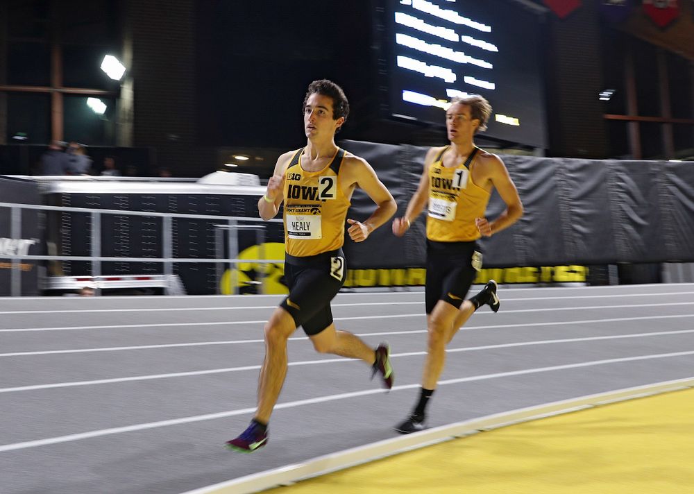 Iowa’s Noah Healy (from left) and Jeff Roberts run the men’s 1 mile run event during the Jimmy Grant Invitational at the Recreation Building in Iowa City on Saturday, December 14, 2019. (Stephen Mally/hawkeyesports.com)