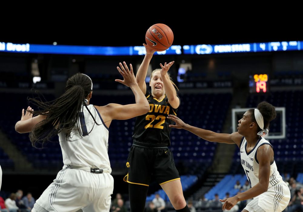 Iowa Hawkeyes guard Kathleen Doyle (22) dishes off a pass against the Penn State Nittany Lions Thursday, January 30, 2020 at the Bryce Jordan Center. (Brian Ray/hawkeyesports.com)