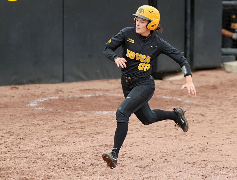 Iowa’s Jayci Vos (00) scores a run during the sixth inning of their game against Iowa Softball vs Indian Hills Community College at Pearl Field in Iowa City on Sunday, Oct 6, 2019. (Stephen Mally/hawkeyesports.com)