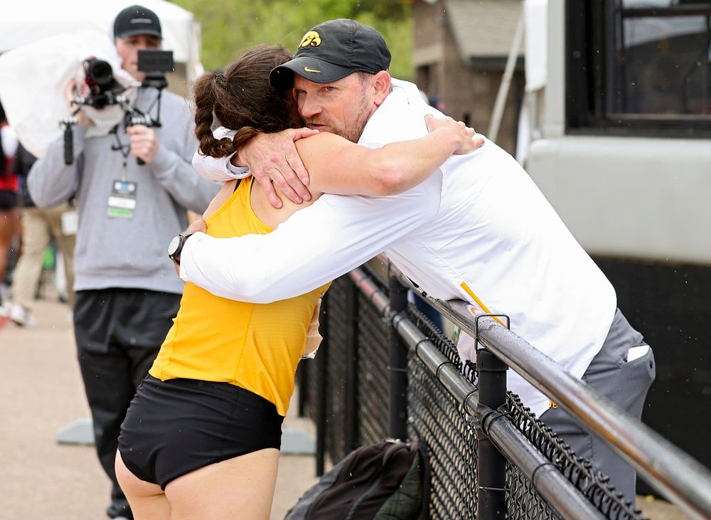 Iowa's Jenny Kimbro (from left) gets a hug from Director of Track and Field Joey Woody after Kimbro ran the women’s 400 meter hurdles event on the third day of the Big Ten Outdoor Track and Field Championships at Francis X. Cretzmeyer Track in Iowa City on Sunday, May. 12, 2019. (Stephen Mally/hawkeyesports.com)