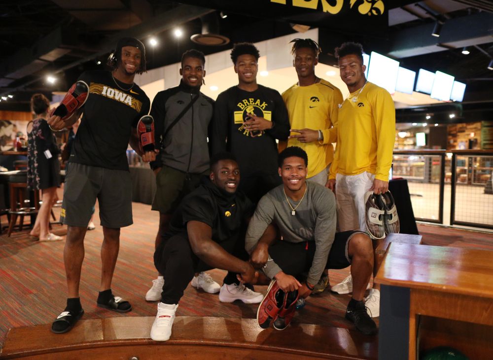 Iowa Hawkeyes wide receiver Ihmir Smith-Marsette (6),defensive back Devonte Young (17), defensive back Kaevon Merriweather (26), wide receiver Brandon Smith (12), running back Ivory Kelly-Martin (21), linebacker Amani Jones (52), and wide receiver Tyrone Tracy Jr. (3) during the Players' Night at Splitsville Friday, December 28, 2018 in the Sparkman Wharf area of Tampa, FL.(Brian Ray/hawkeyesports.com)