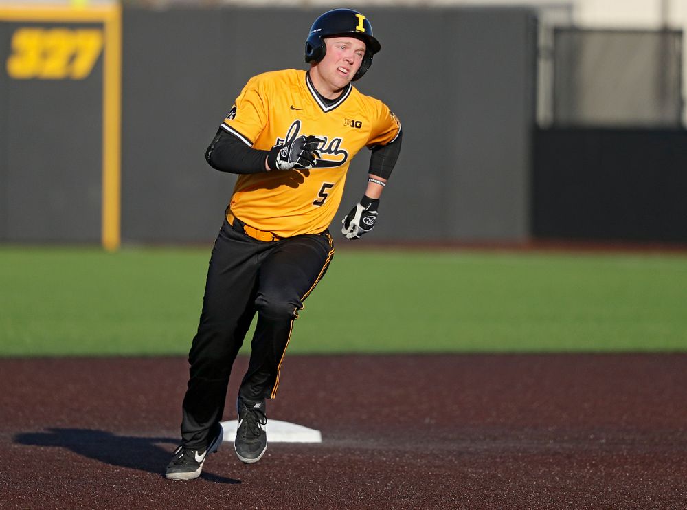 Iowa Hawkeyes pinch hitter Zeb Adreon (5) rounds second base on his way to third after hitting a triple during the seventh inning of their game at Duane Banks Field in Iowa City on Tuesday, Apr. 2, 2019. (Stephen Mally/hawkeyesports.com)