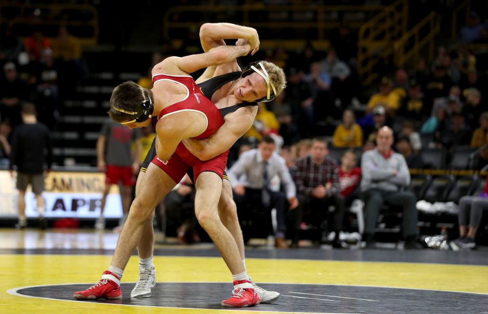 IowaÕs Kaleb Young wrestles WisconsinÕs Garrett Model at 157 pounds Sunday, December 1, 2019 at Carver-Hawkeye Arena. Young won the match 12-6. (Brian Ray/hawkeyesports.com)