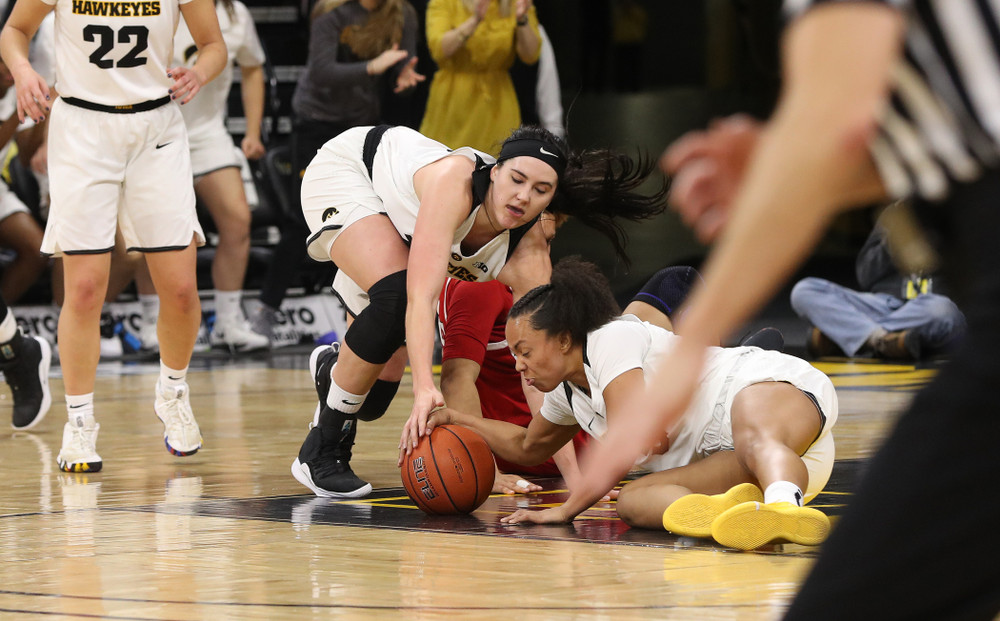 Iowa Hawkeyes forward Megan Gustafson (10) and guard Alexis Sevillian (5) against the Rutgers Scarlet Knights Wednesday, January 23, 2019 at Carver-Hawkeye Arena. (Brian Ray/hawkeyesports.com)