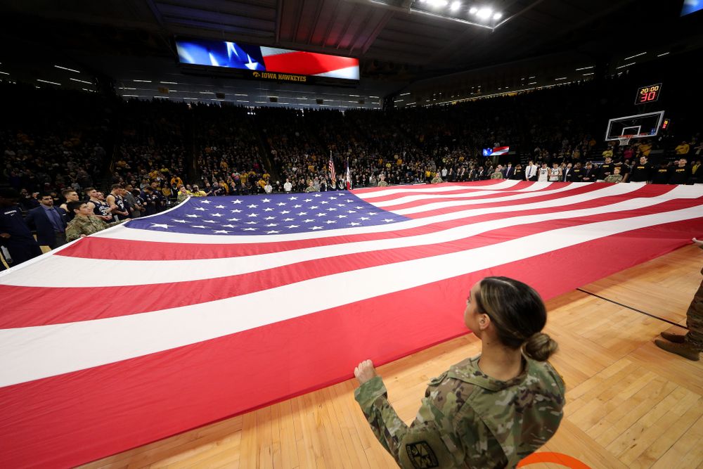 Members of the Iowa Army ROTC display a large American flag before the Iowa Hawkeyes game against Penn State Saturday, February 29, 2020 at Carver-Hawkeye Arena. (Brian Ray/hawkeyesports.com)