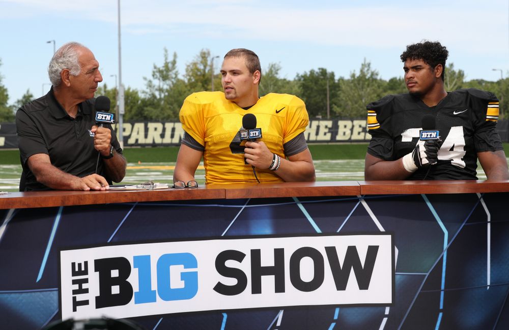 Iowa Hawkeyes quarterback Nate Stanley (4) and offensive lineman Tristan Wirfs (74) on the set of the BTN Tailgate Tour following fall camp Practice No. 16 Tuesday, August 20, 2019 at the Ronald D. and Margaret L. Kenyon Football Practice Facility. (Brian Ray/hawkeyesports.com)