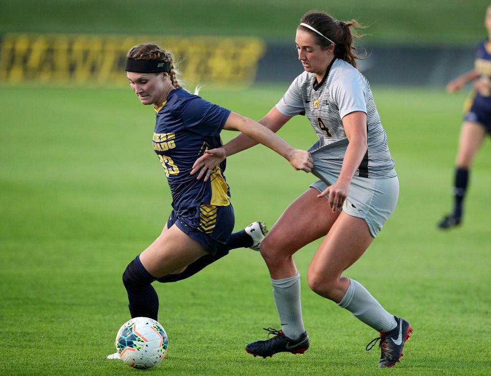 Iowa forward Kaleigh Haus (4) battles for position on the ball during the first half of their match at the Iowa Soccer Complex in Iowa City on Friday, Sep 13, 2019. (Stephen Mally/hawkeyesports.com)