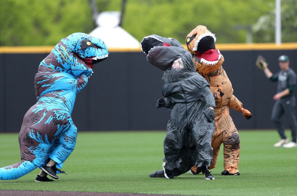 Rachel Heller, Susie Lund, and Emily run the dinosaur race during the Iowa Hawkeyes game against Michigan State Sunday, May 12, 2019 at Duane Banks Field. (Brian Ray/hawkeyesports.com)