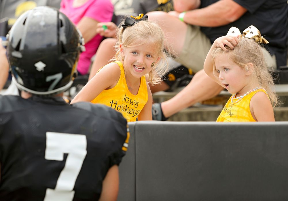 Two young fans talk with Iowa Hawkeyes punter Colten Rastetter (7) during Fall Camp Practice No. 8 at Kids Day at Kinnick Stadium in Iowa City on Saturday, Aug 10, 2019. (Stephen Mally/hawkeyesports.com)