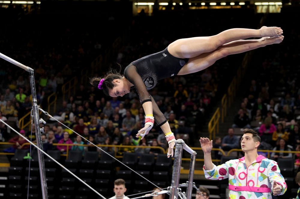 Iowa’s Carina Tolan competes on the bars against Michigan Friday, February 14, 2020 at Carver-Hawkeye Arena. (Brian Ray/hawkeyesports.com)