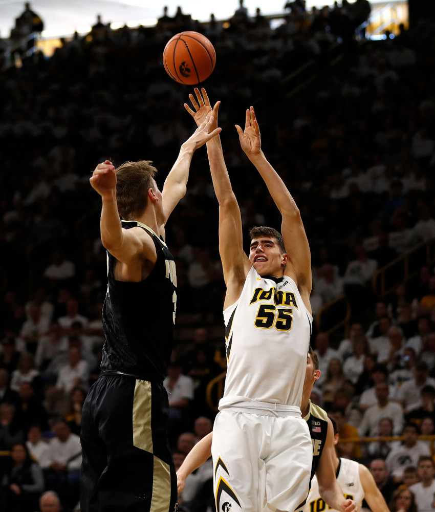 Iowa Hawkeyes forward Luka Garza (55) 