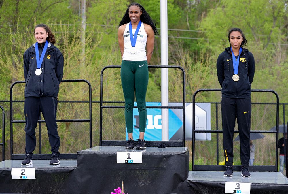 Iowa's Jenny Kimbro (left) and Tria Simmons (right) on the award stand after placing second and third in the heptathlon event on the second day of the Big Ten Outdoor Track and Field Championships at Francis X. Cretzmeyer Track in Iowa City on Saturday, May. 11, 2019. (Stephen Mally/hawkeyesports.com)