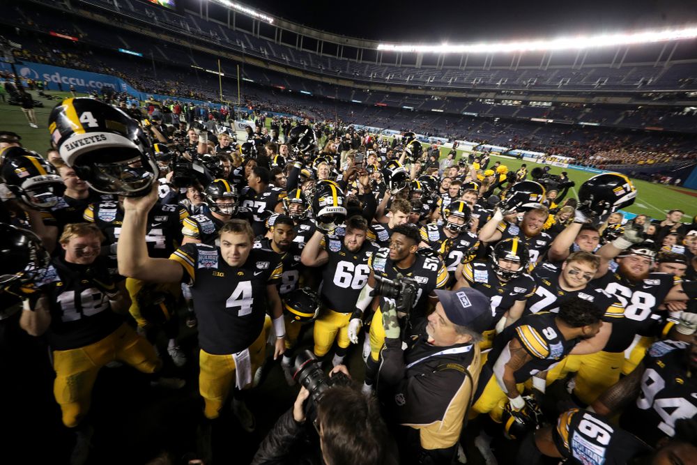 The Iowa Hawkeyes sing the Fight Song after their win against USC in the Holiday Bowl Friday, December 27, 2019 at San Diego Community Credit Union Stadium.  (Brian Ray/hawkeyesports.com)