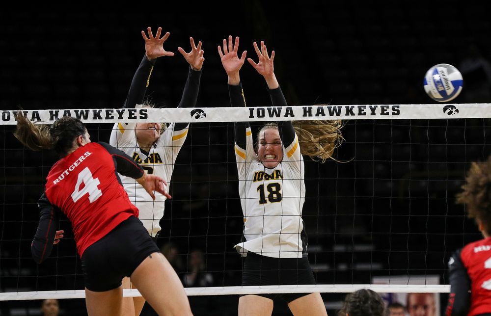 Iowa Hawkeyes right side hitter Reghan Coyle (8) and Iowa Hawkeyes middle blocker Hannah Clayton (18) go up for a block during a match against Rutgers at Carver-Hawkeye Arena on November 2, 2018. (Tork Mason/hawkeyesports.com)