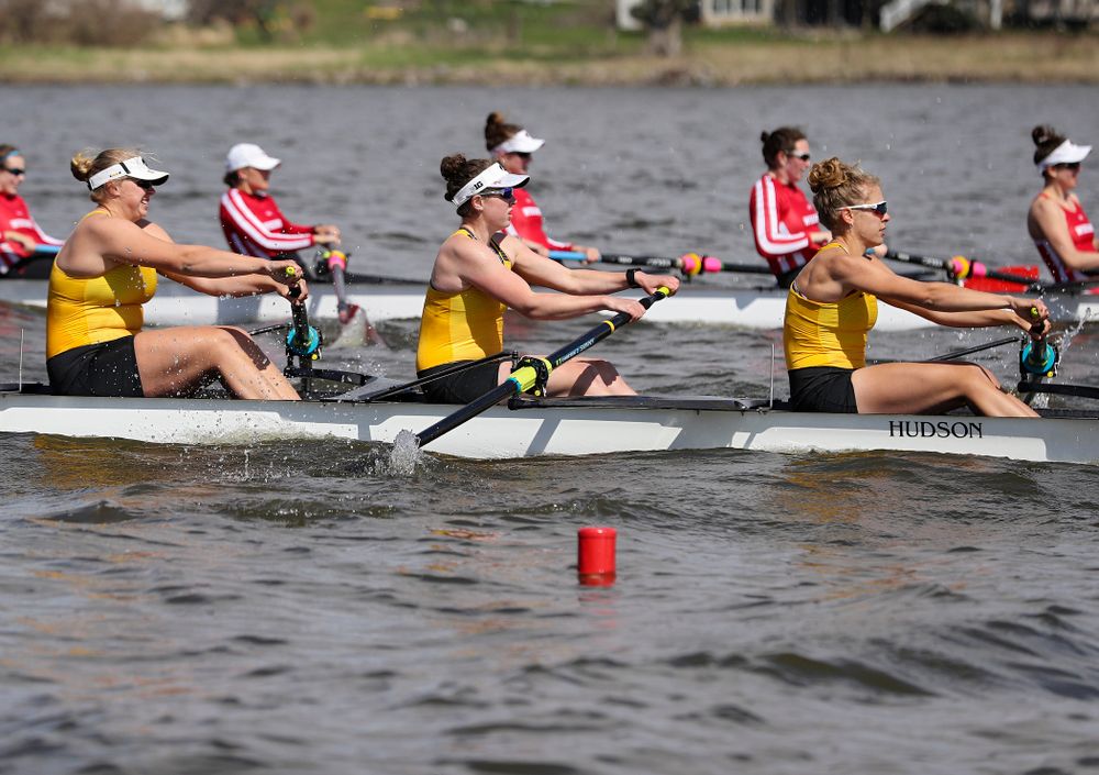 Iowa's Contessa Harold (from left), Katie Pearson, and Eve Stewart during their 1 Varsity 8 race against Wisconsin in their Big Ten Double Dual Rowing Regatta at Lake Macbride in Solon on Saturday, Apr. 13, 2019. (Stephen Mally/hawkeyesports.com)