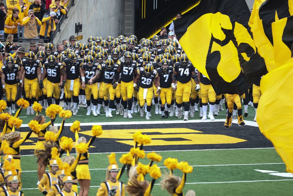 The Iowa Hawkeyes swarm onto the field for their game against Middle Tennessee State Saturday, September 28, 2019 at Kinnick Stadium. (Max Allen/hawkeyesports.com)