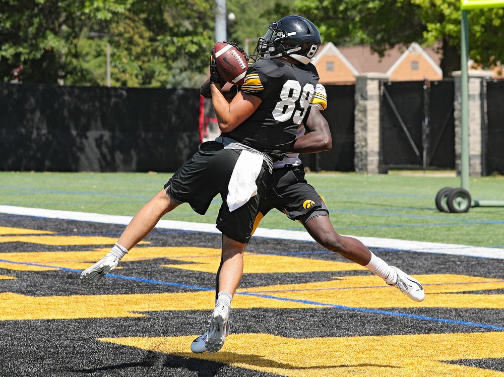 Iowa Hawkeyes wide receiver Nico Ragaini (89) pulls in a touchdown pass during Fall Camp Practice No. 7 at the Hansen Football Performance Center in Iowa City on Friday, Aug 9, 2019. (Stephen Mally/hawkeyesports.com)
