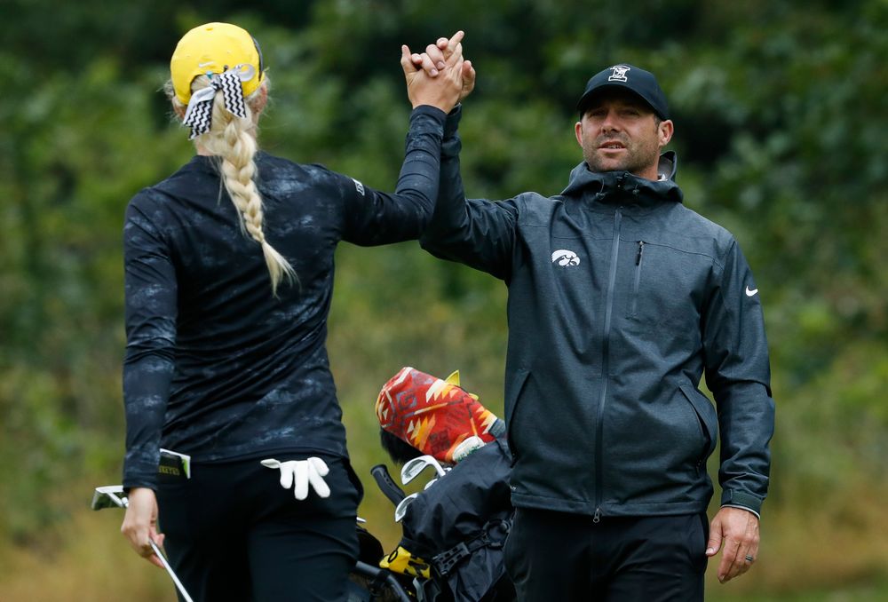 Iowa women's golf assistant coach Michael Roters congratulates Shawn Rennegarbe after her round during the final round of the Diane Thomason Invitational at Finkbine Golf Course on September 30, 2018. (Tork Mason/hawkeyesports.com)