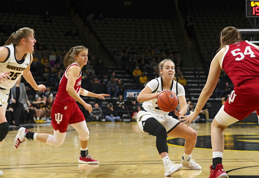 Iowa Hawkeyes guard Kathleen Doyle (22) passes the ball for an assist on a score during the first quarter of their game at Carver-Hawkeye Arena in Iowa City on Sunday, January 12, 2020. (Stephen Mally/hawkeyesports.com)