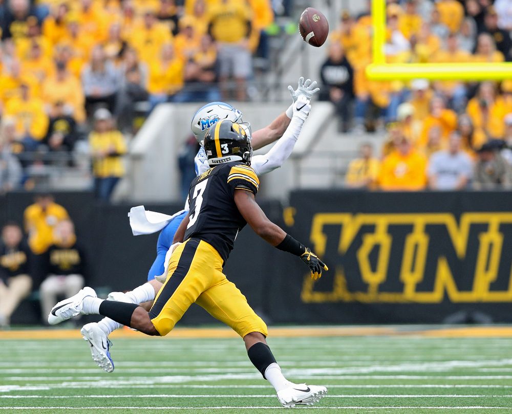 Iowa Hawkeyes wide receiver Tyrone Tracy Jr. (3) pulls in a pass after it bounced off the hands of Middle Tennessee State free safety Reed Blankenship (12) during the first quarter of their game at Kinnick Stadium in Iowa City on Saturday, Sep 28, 2019. (Stephen Mally/hawkeyesports.com)