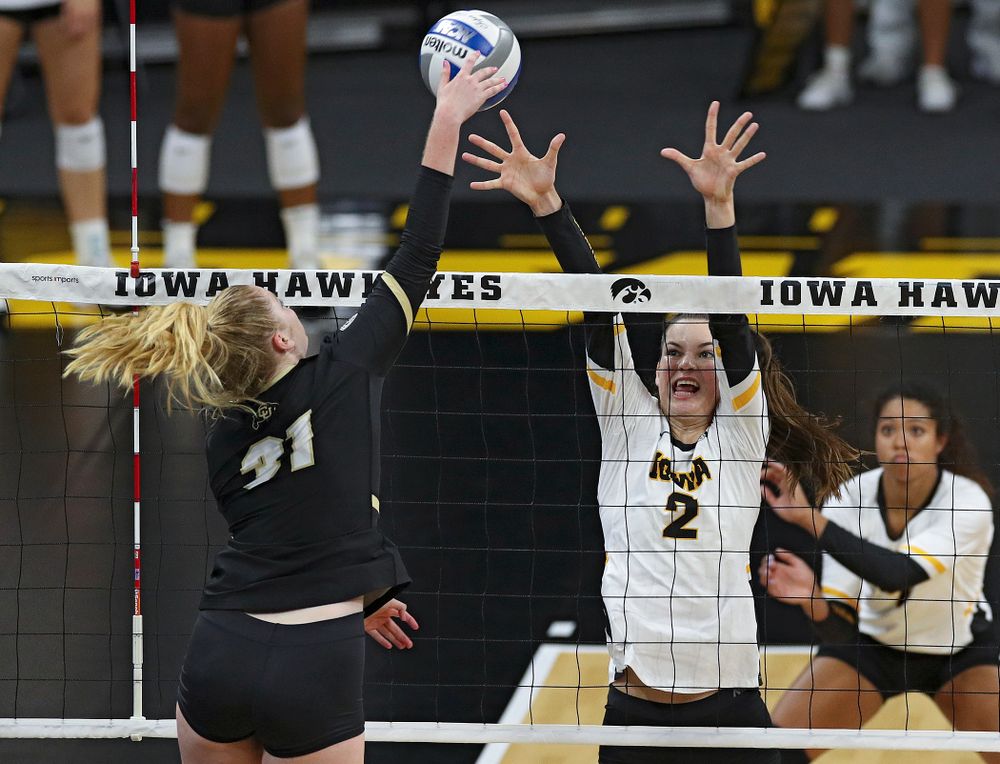 Iowa’s Courtney Buzzerio (2) tries for a block during the first set of their Big Ten/Pac-12 Challenge match against Colorado at Carver-Hawkeye Arena in Iowa City on Friday, Sep 6, 2019. (Stephen Mally/hawkeyesports.com)