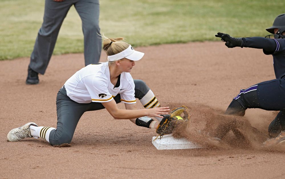 Iowa Hawkeyes Aralee Bogar (2) tries for a tag at second base during the first inning of their Big Ten Conference softball game at Pearl Field in Iowa City on Friday, Mar. 29, 2019. (Stephen Mally/hawkeyesports.com)