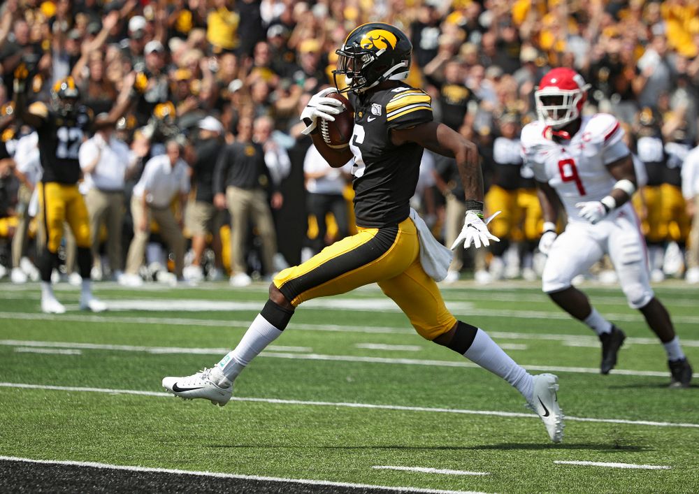Iowa Hawkeyes wide receiver Ihmir Smith-Marsette (6) high steps to the end zone on a 23-yard touchdown reception during the third quarter of their Big Ten Conference football game at Kinnick Stadium in Iowa City on Saturday, Sep 7, 2019. (Stephen Mally/hawkeyesports.com)
